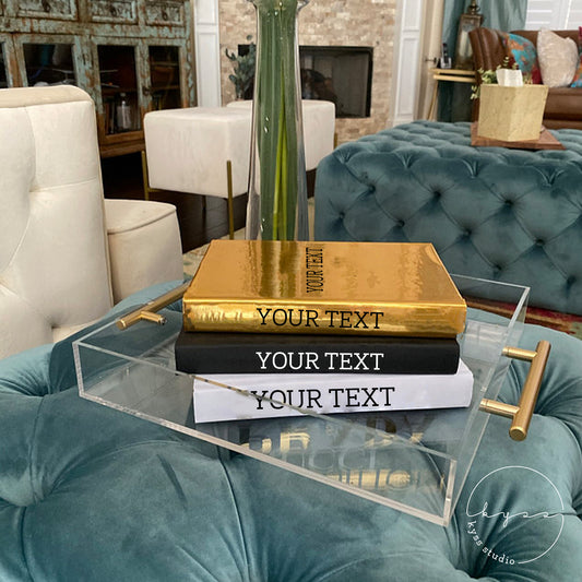 Kyss Studio - Glam your bookshelf or coffee table with luxury designer books.  Stack them up in classic style or choose the color that will take your room  to new heights of